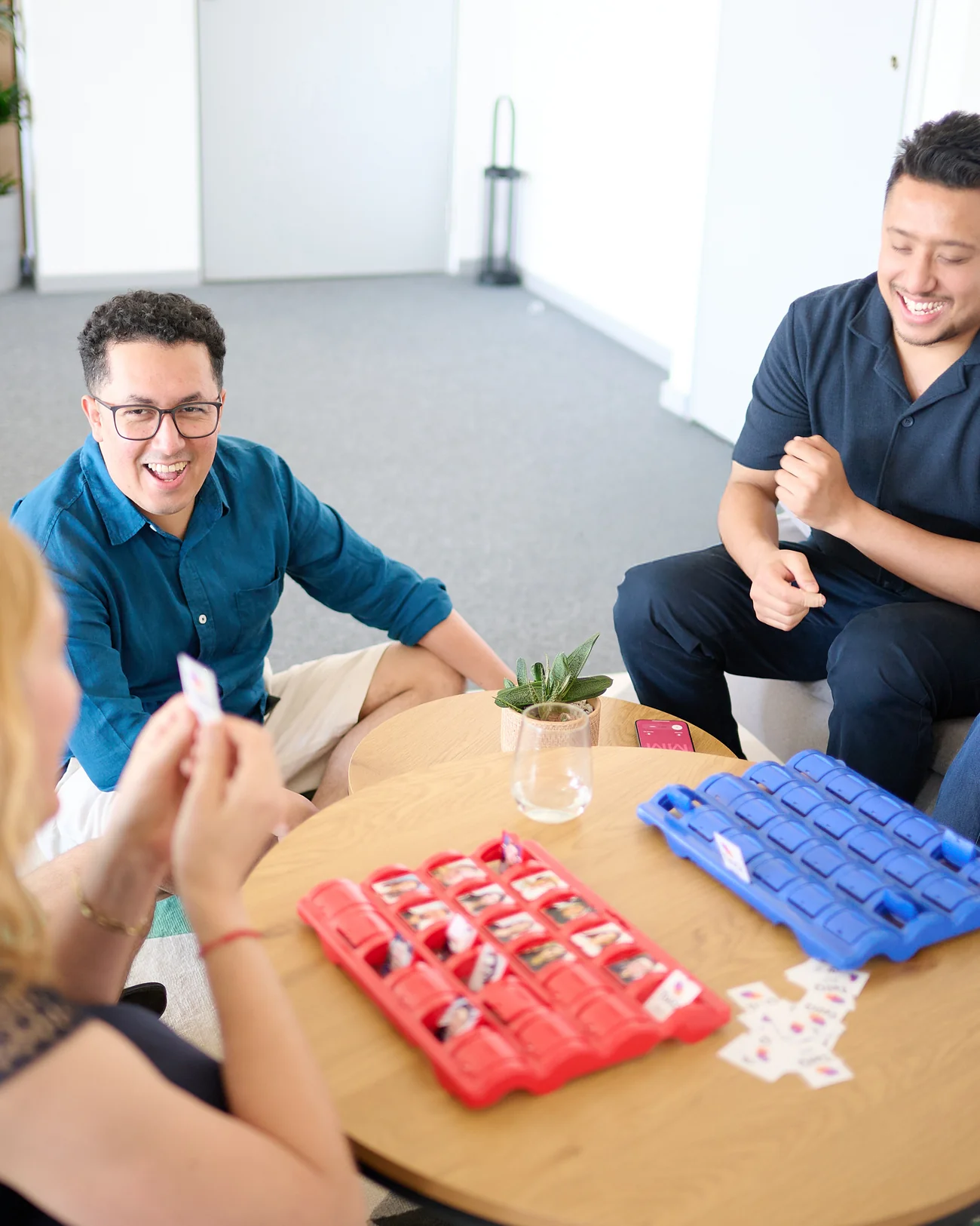 ClickTerm team members playing a game together around a table in the office