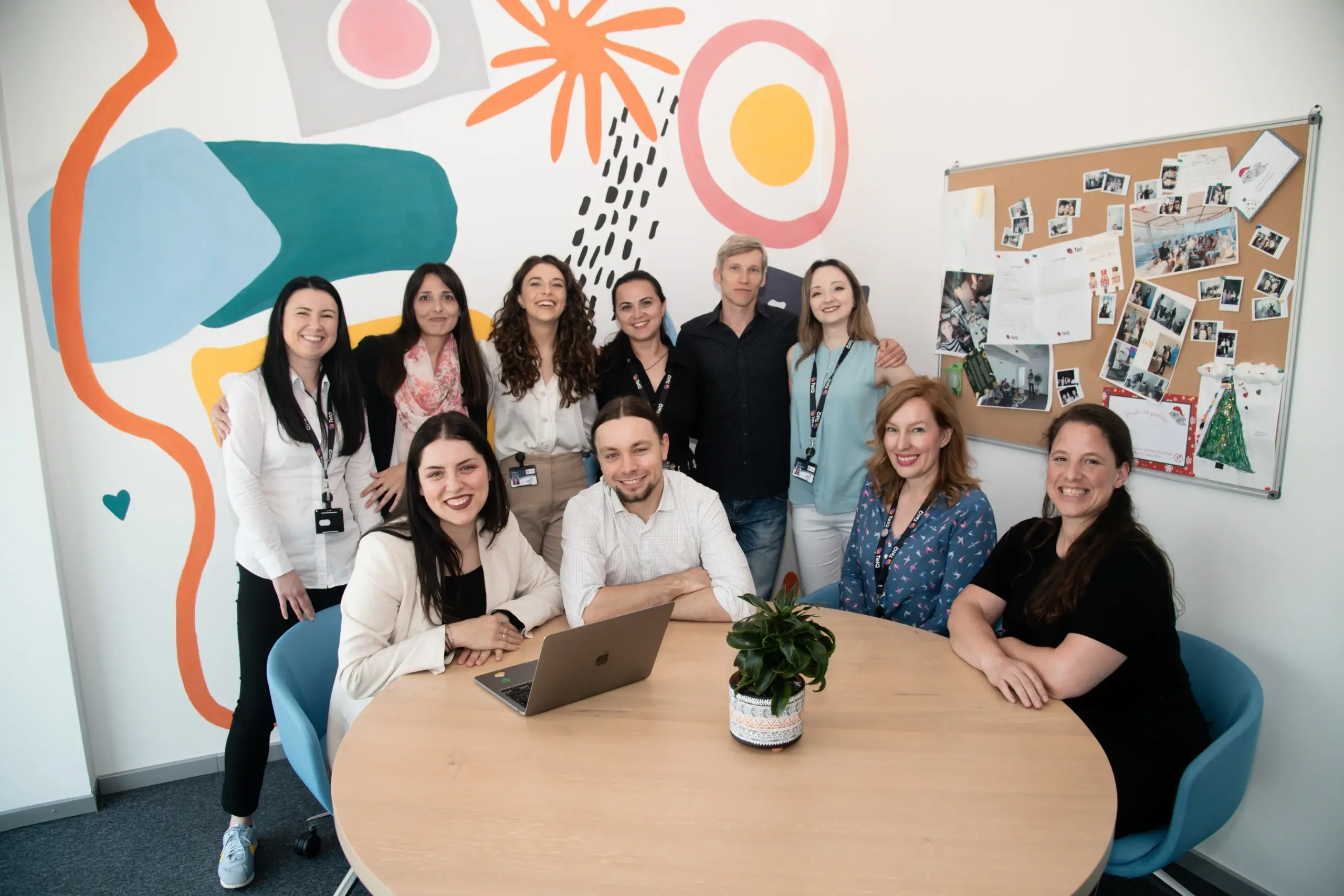 The TelQ Telecom team behind ClickTerm gathered around a table in the office